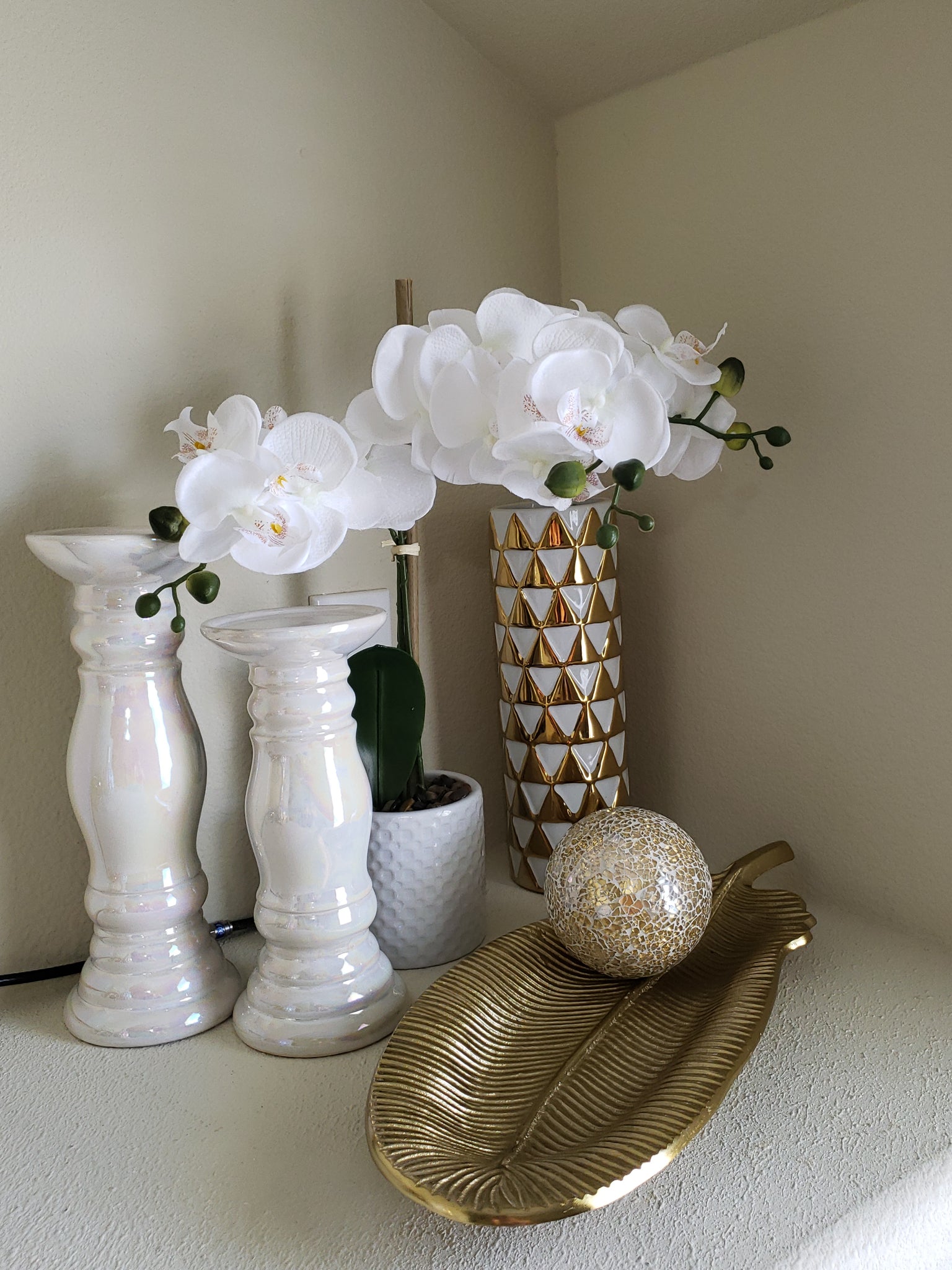 White and gold patterened cylindrical vase