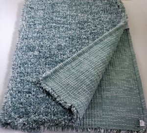 Woven teal and white shaggy rug 48 x 65 inches