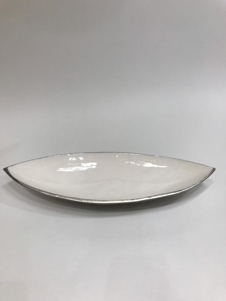 White decorative canoe shaped bowl with silver border