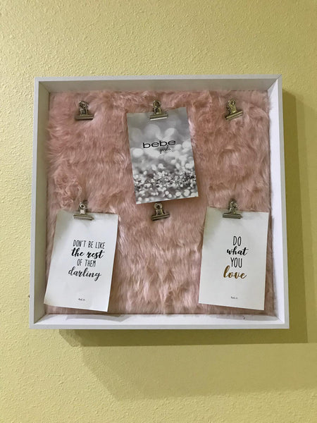 Notice board pink fluffy background with silver clips