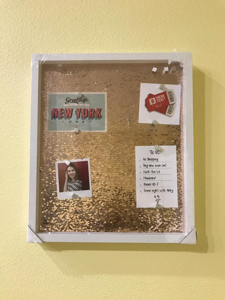 notice board with pink sequins background and silver magnets