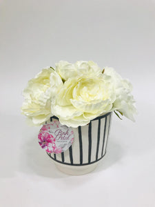 ivory floral arrangement with black and white vase 8 inches