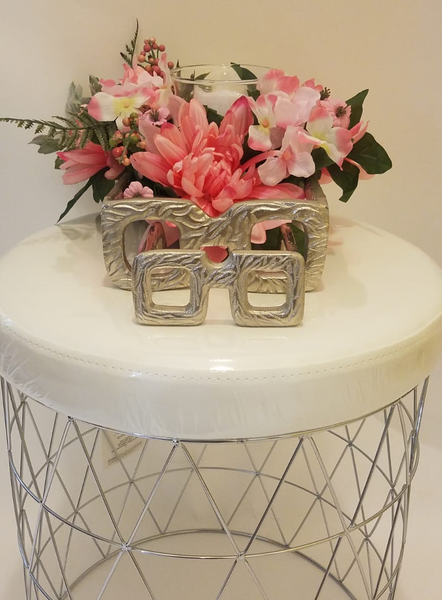 pink floral arrangement with candle holder
